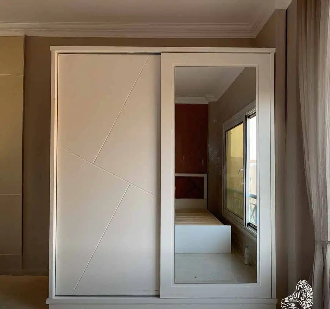 Modern White Sliding Wardrobe with Mirrored Door & Geometric Inlays